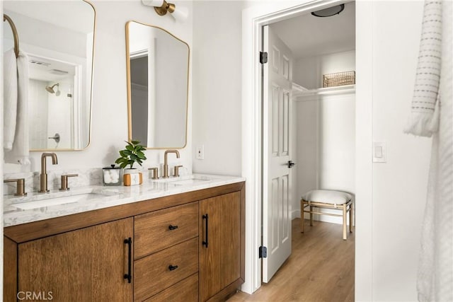 16917 Eric Ave, Cerritos, CA 90703 - bathroom with double vanity and wood finished floors