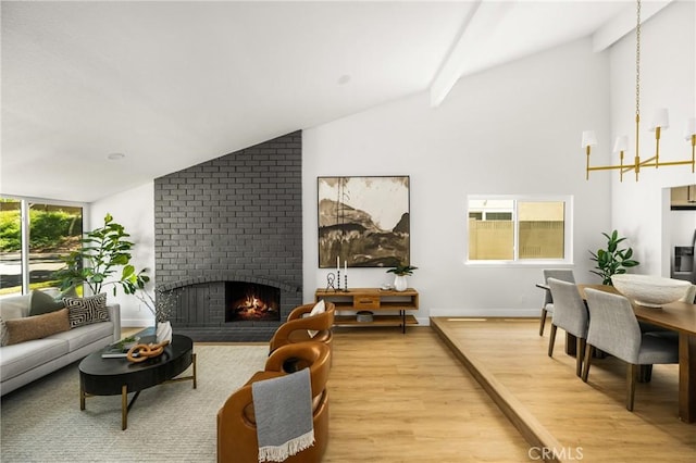 16917 Eric Ave, Cerritos, CA 90703 - living area featuring a brick fireplace, light wood-type flooring, a chandelier, beamed ceiling, and high vaulted ceiling