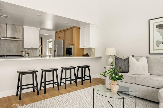 16917 Eric Ave, Cerritos, CA 90703 - living area with light wood-type flooring and baseboards