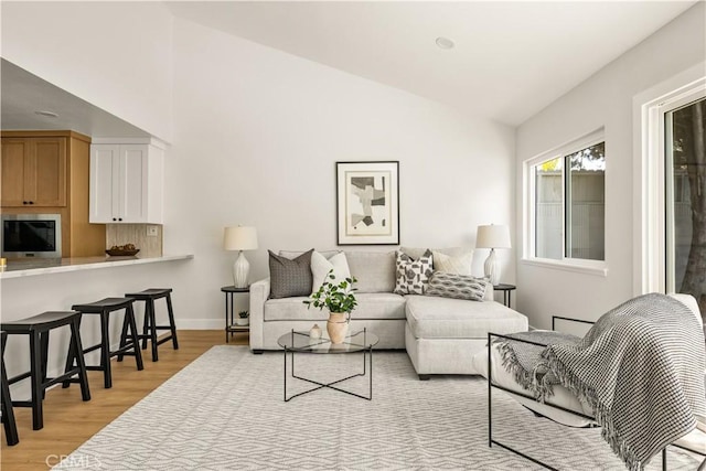 16917 Eric Ave, Cerritos, CA 90703 - living area featuring light wood-type flooring and vaulted ceiling