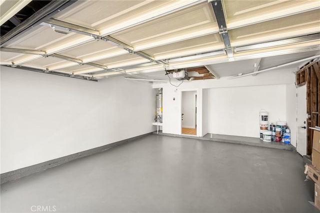 16917 Eric Ave, Cerritos, CA 90703 - garage with a garage door opener and secured water heater