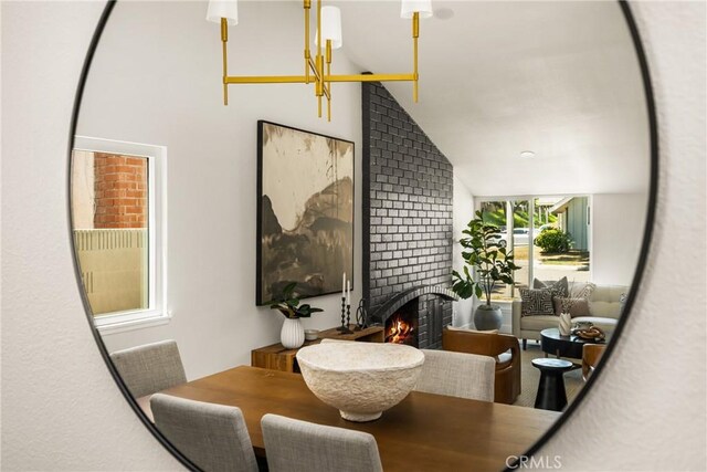 16917 Eric Ave, Cerritos, CA 90703 - dining space with vaulted ceiling and a brick fireplace