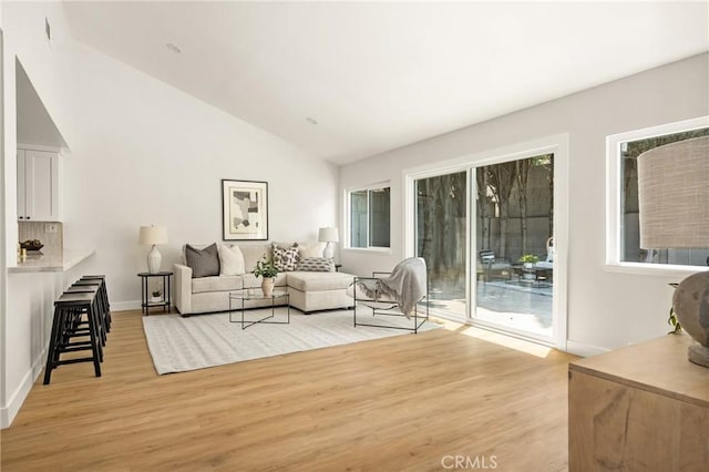 16917 Eric Ave, Cerritos, CA 90703 - living area featuring light wood-style flooring and vaulted ceiling