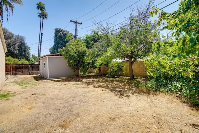 8084 Magnolia Ave, Riverside, CA 92504 - fenced backyard with an outdoor structure