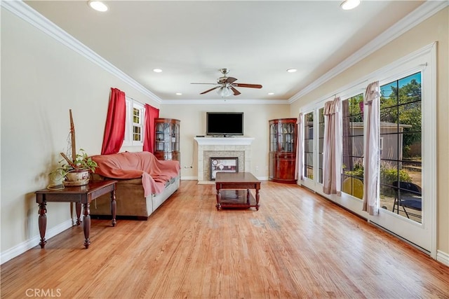 8084 Magnolia Ave, Riverside, CA 92504 - living area with ceiling fan, a fireplace with flush hearth, light wood-type flooring, ornamental molding, and recessed lighting