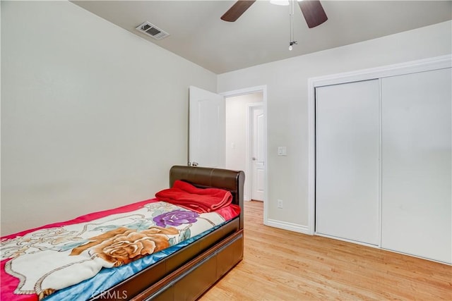 8084 Magnolia Ave, Riverside, CA 92504 - bedroom with light wood-style flooring, a ceiling fan, and a closet