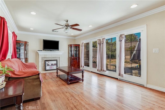 8084 Magnolia Ave, Riverside, CA 92504 - living area featuring a tile fireplace, a ceiling fan, wood finished floors, recessed lighting, and ornamental molding