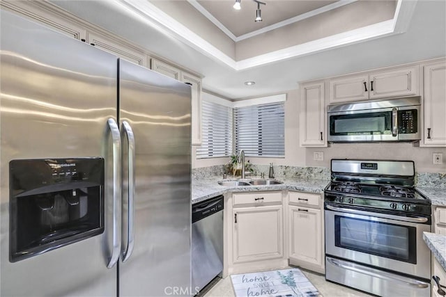 28191 Sorrento Unit 111, Laguna Niguel, CA 92677 - kitchen with stainless steel appliances, ornamental molding, light stone countertops, light tile patterned flooring, and white cabinetry
