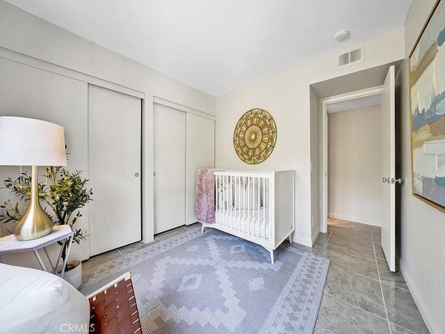 28191 Sorrento Unit 111, Laguna Niguel, CA 92677 - unfurnished bedroom featuring multiple closets and baseboards