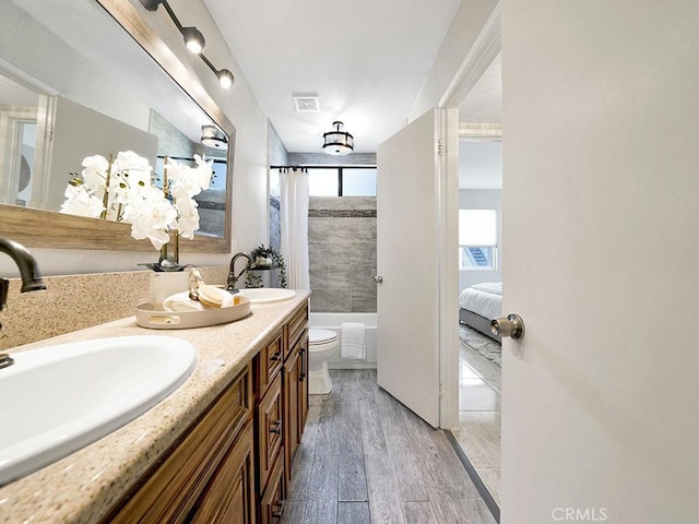 28191 Sorrento Unit 111, Laguna Niguel, CA 92677 - full bath with shower / tub combo with curtain, double vanity, and wood finished floors