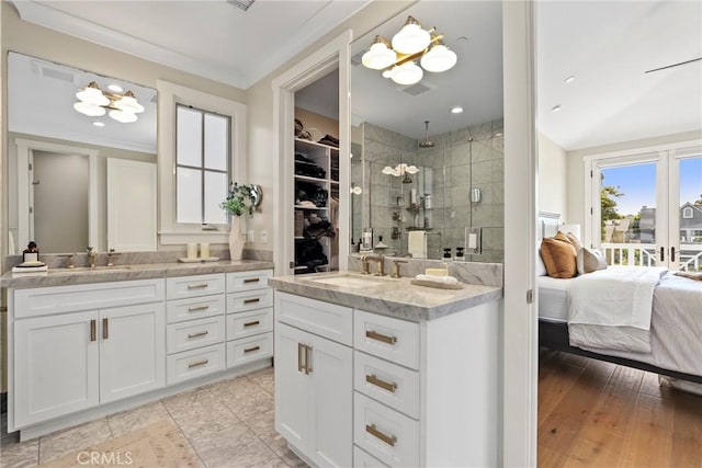 716 Elvira Ave Unit A, Redondo Beach, CA 90277 - bathroom with a shower stall, vanity, crown molding, a chandelier, and a walk in closet