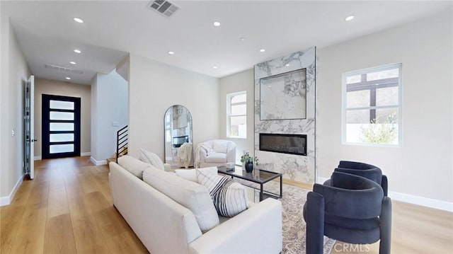 421 N Catalina St, Burbank, CA 91505 - living room with light wood-type flooring, a fireplace, recessed lighting, and stairway