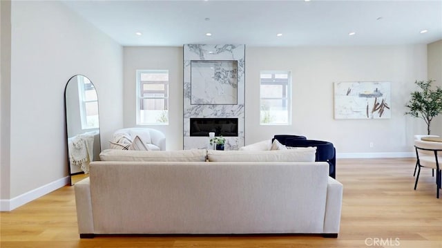 421 N Catalina St, Burbank, CA 91505 - living area with plenty of natural light, light wood-style floors, a fireplace, and recessed lighting