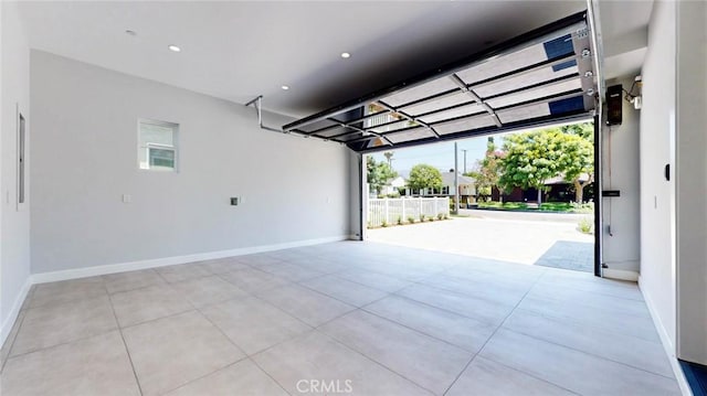 421 N Catalina St, Burbank, CA 91505 - garage featuring baseboards and recessed lighting
