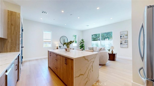421 N Catalina St, Burbank, CA 91505 - kitchen with freestanding refrigerator, a center island, light wood finished floors, modern cabinets, and recessed lighting