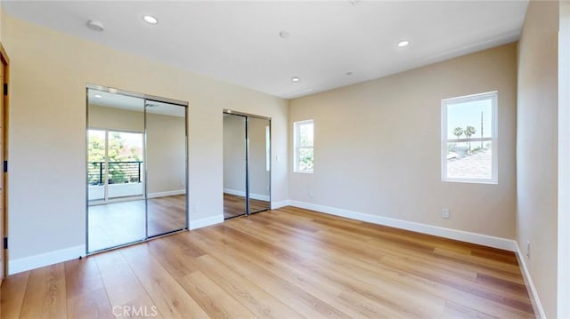 421 N Catalina St, Burbank, CA 91505 - unfurnished bedroom featuring two closets, light wood-style flooring, and recessed lighting
