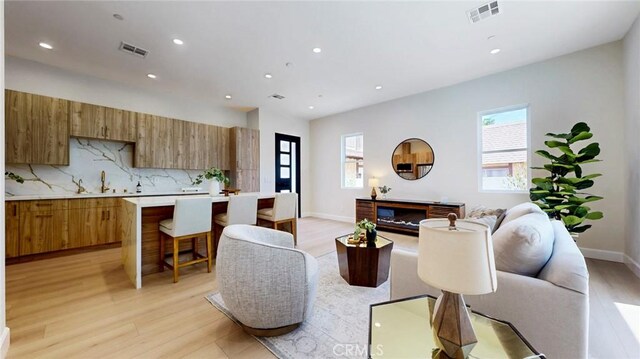 421 N Catalina St, Burbank, CA 91505 - living room featuring light wood-style flooring and recessed lighting