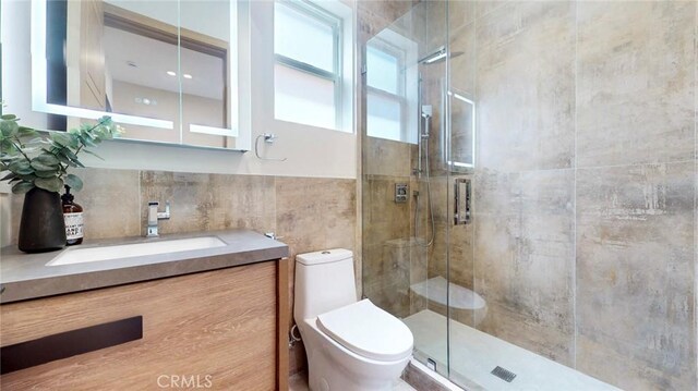 421 N Catalina St, Burbank, CA 91505 - bathroom featuring tile walls, a stall shower, and vanity