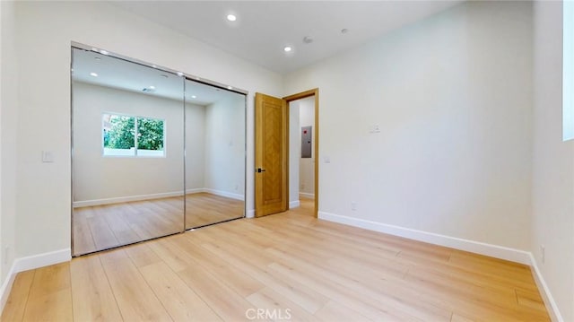 421 N Catalina St, Burbank, CA 91505 - unfurnished bedroom featuring light wood finished floors, a closet, recessed lighting, and electric panel