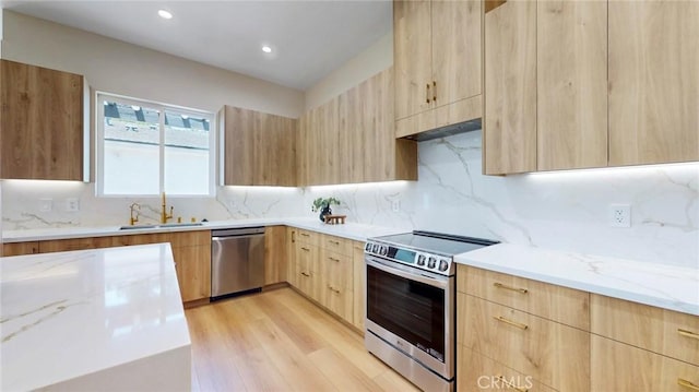 421 N Catalina St, Burbank, CA 91505 - kitchen with appliances with stainless steel finishes, modern cabinets, light brown cabinets, light stone counters, and recessed lighting