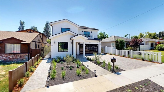 421 N Catalina St, Burbank, CA 91505 - view of front of property with a balcony, driveway, stucco siding, and an attached garage