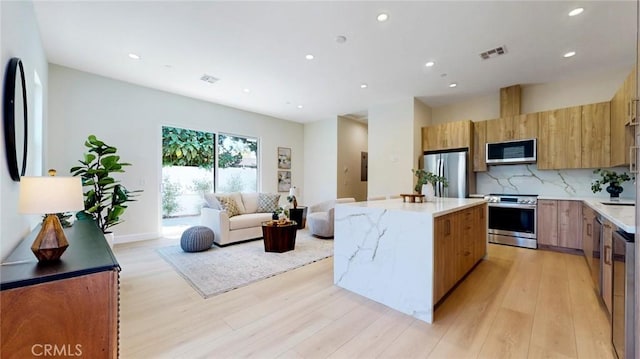421 N Catalina St, Burbank, CA 91505 - kitchen featuring stainless steel appliances, recessed lighting, light wood-style flooring, a kitchen island, and modern cabinets