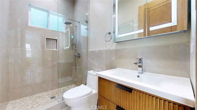 421 N Catalina St, Burbank, CA 91505 - bathroom featuring tile walls, a tile shower, and vanity