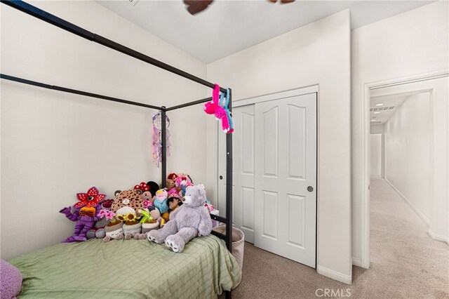 8495 E Preserve Loop, Chino, CA 91708 - bedroom with light carpet, a closet, and ceiling fan