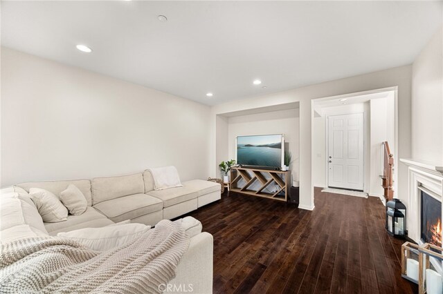 8495 E Preserve Loop, Chino, CA 91708 - living room with wood finished floors, recessed lighting, and a warm lit fireplace