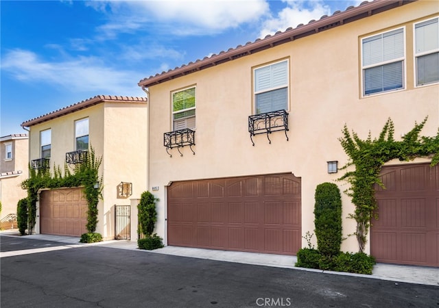 8495 E Preserve Loop, Chino, CA 91708 - mediterranean / spanish house with stucco siding, a garage, and a tile roof