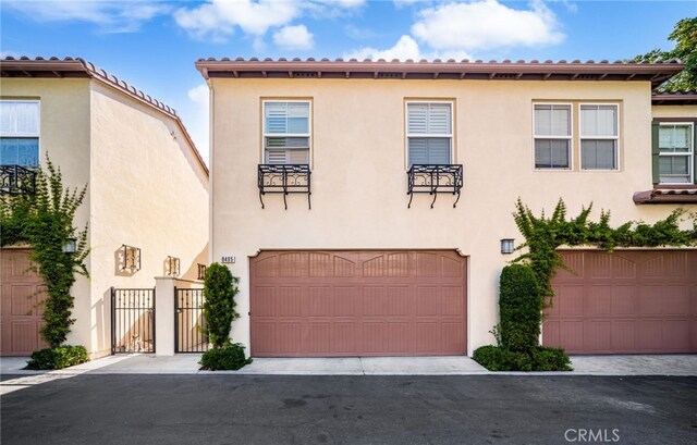 8495 E Preserve Loop, Chino, CA 91708 - mediterranean / spanish-style home featuring stucco siding and a garage