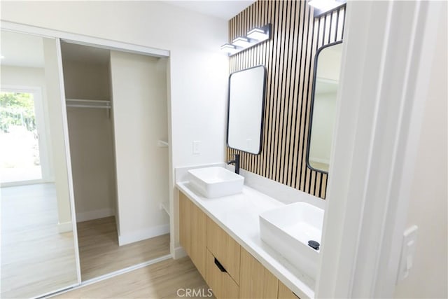 1925 Walnut Leaf Dr, Walnut, CA 91789 - bathroom featuring wood finished floors and double vanity