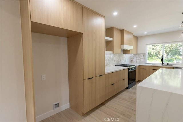 1925 Walnut Leaf Dr, Walnut, CA 91789 - kitchen with range with gas cooktop, modern cabinets, light brown cabinets, tasteful backsplash, and recessed lighting
