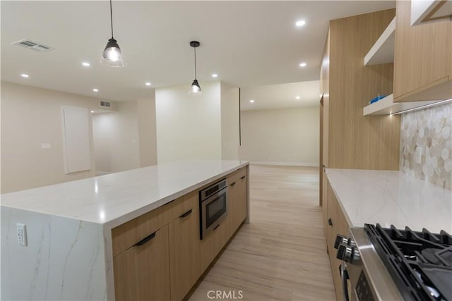 1925 Walnut Leaf Dr, Walnut, CA 91789 - kitchen with modern cabinets, light brown cabinetry, light wood-style flooring, a spacious island, and stainless steel appliances