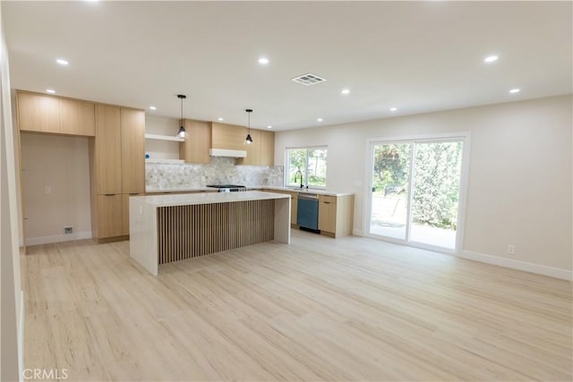 1925 Walnut Leaf Dr, Walnut, CA 91789 - kitchen with modern cabinets, a center island, light wood-style flooring, recessed lighting, and backsplash