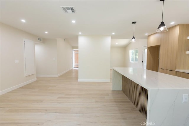 1925 Walnut Leaf Dr, Walnut, CA 91789 - kitchen with modern cabinets, light wood-style floors, open floor plan, recessed lighting, and a spacious island