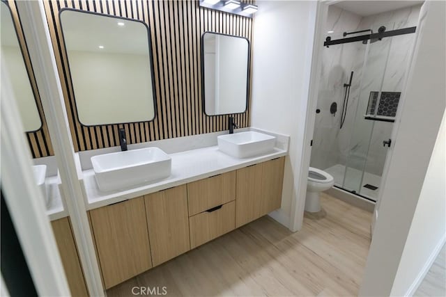 1925 Walnut Leaf Dr, Walnut, CA 91789 - bathroom featuring a marble finish shower, wood finished floors, and double vanity