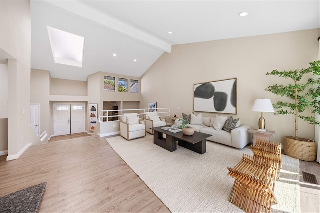 15 Valley Vw, Irvine, CA 92612 - living room featuring wood finished floors, beamed ceiling, a skylight, high vaulted ceiling, and recessed lighting