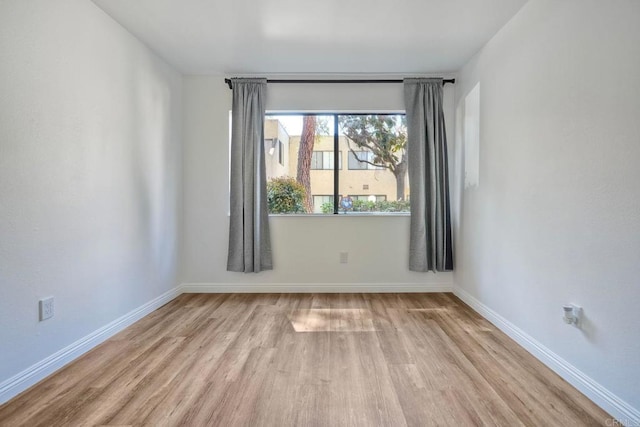 391 N Melrose Unit A, Vista, CA 92083 - spare room with wood finished floors and baseboards