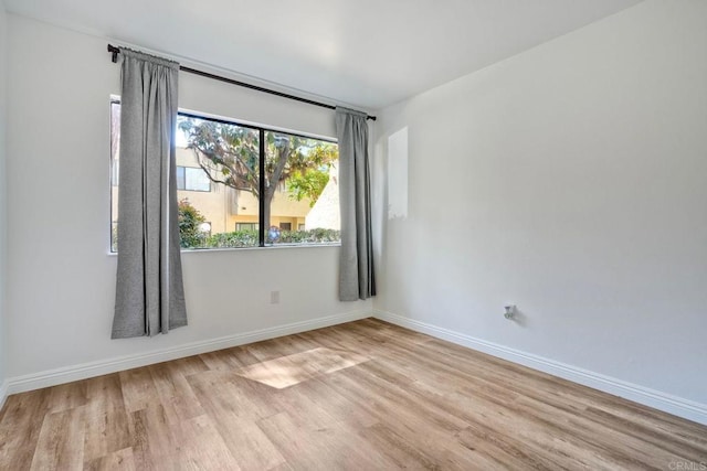 391 N Melrose Unit A, Vista, CA 92083 - spare room featuring wood finished floors and baseboards