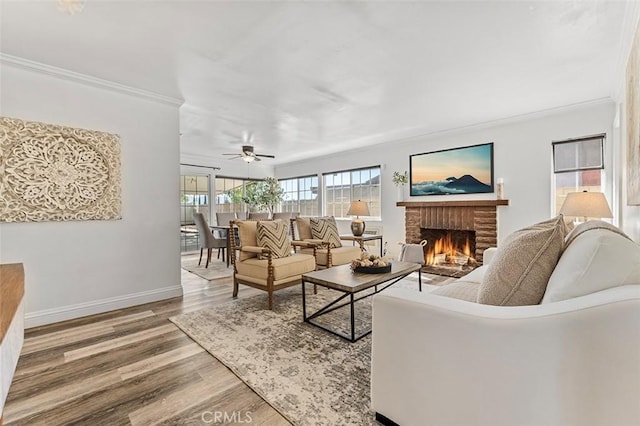 4268 Baggett Dr, Riverside, CA 92505 - living area with a brick fireplace, crown molding, wood finished floors, and a ceiling fan