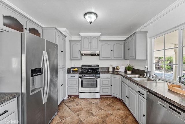 4268 Baggett Dr, Riverside, CA 92505 - kitchen with appliances with stainless steel finishes, under cabinet range hood, dark countertops, crown molding, and gray cabinets