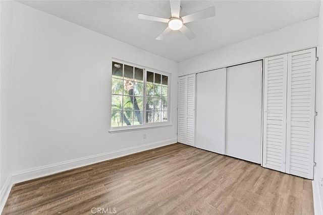 4268 Baggett Dr, Riverside, CA 92505 - unfurnished bedroom featuring wood finished floors, a closet, and ceiling fan
