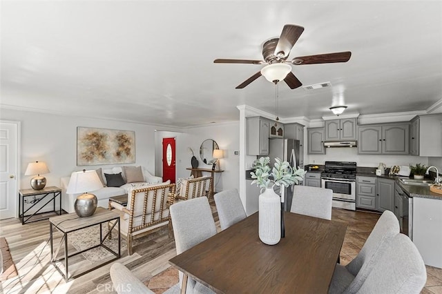 4268 Baggett Dr, Riverside, CA 92505 - dining room featuring a ceiling fan and crown molding