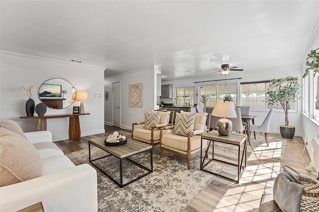 4268 Baggett Dr, Riverside, CA 92505 - living room featuring ornamental molding, light wood finished floors, and a ceiling fan