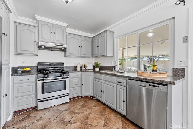 4268 Baggett Dr, Riverside, CA 92505 - kitchen with stainless steel appliances, under cabinet range hood, dark countertops, gray cabinets, and ornamental molding