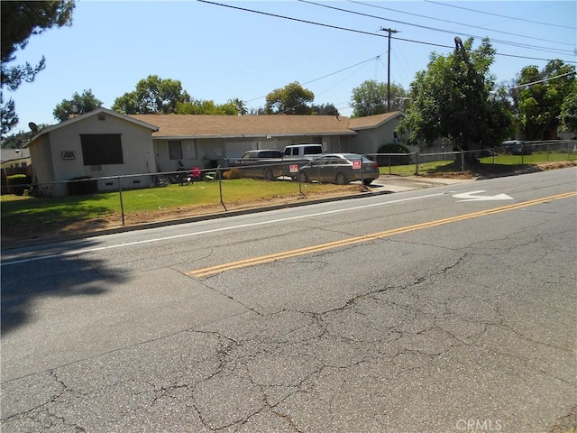 4121 Harrison St, Riverside, CA 92503 - view of front of property featuring concrete driveway and a fenced front yard