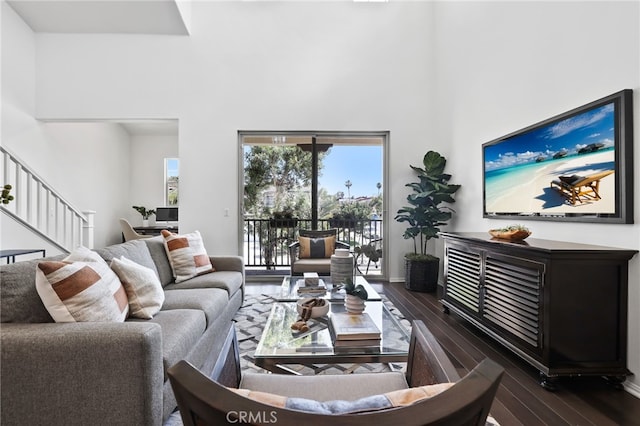 2950 19th St Unit 113, Signal Hill, CA 92707 - living area featuring a high ceiling, wood-type flooring, and stairway