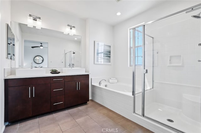 2950 19th St Unit 113, Signal Hill, CA 92707 - full bathroom featuring a shower stall, double vanity, a bath, ceiling fan, and tile patterned floors
