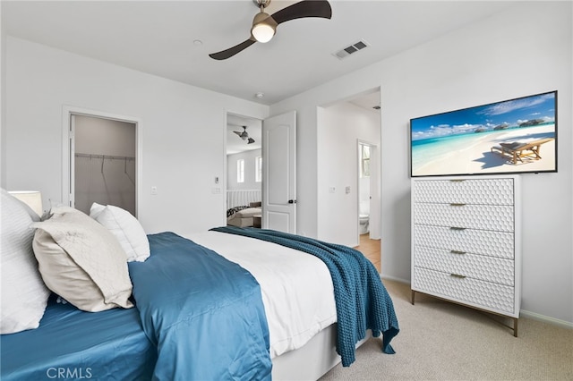 2950 19th St Unit 113, Signal Hill, CA 92707 - bedroom with light colored carpet, ensuite bathroom, ceiling fan, and a spacious closet